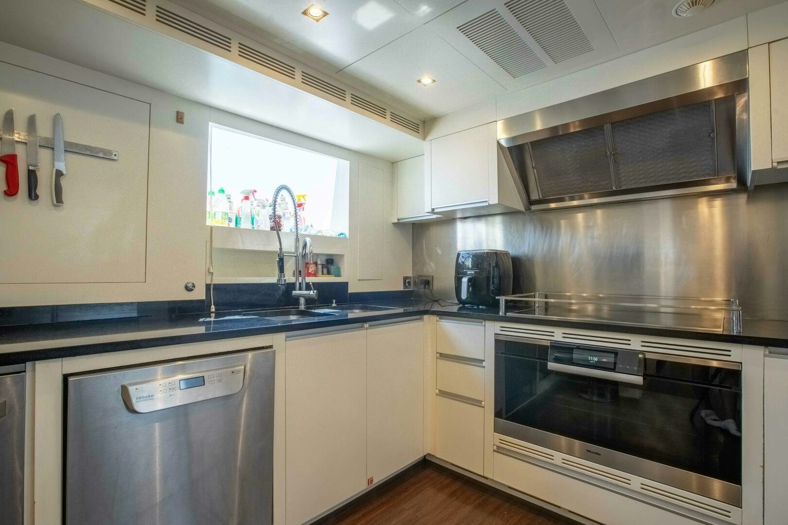 a kitchen with a sink and stove aboard SAFAD Yacht for Sale