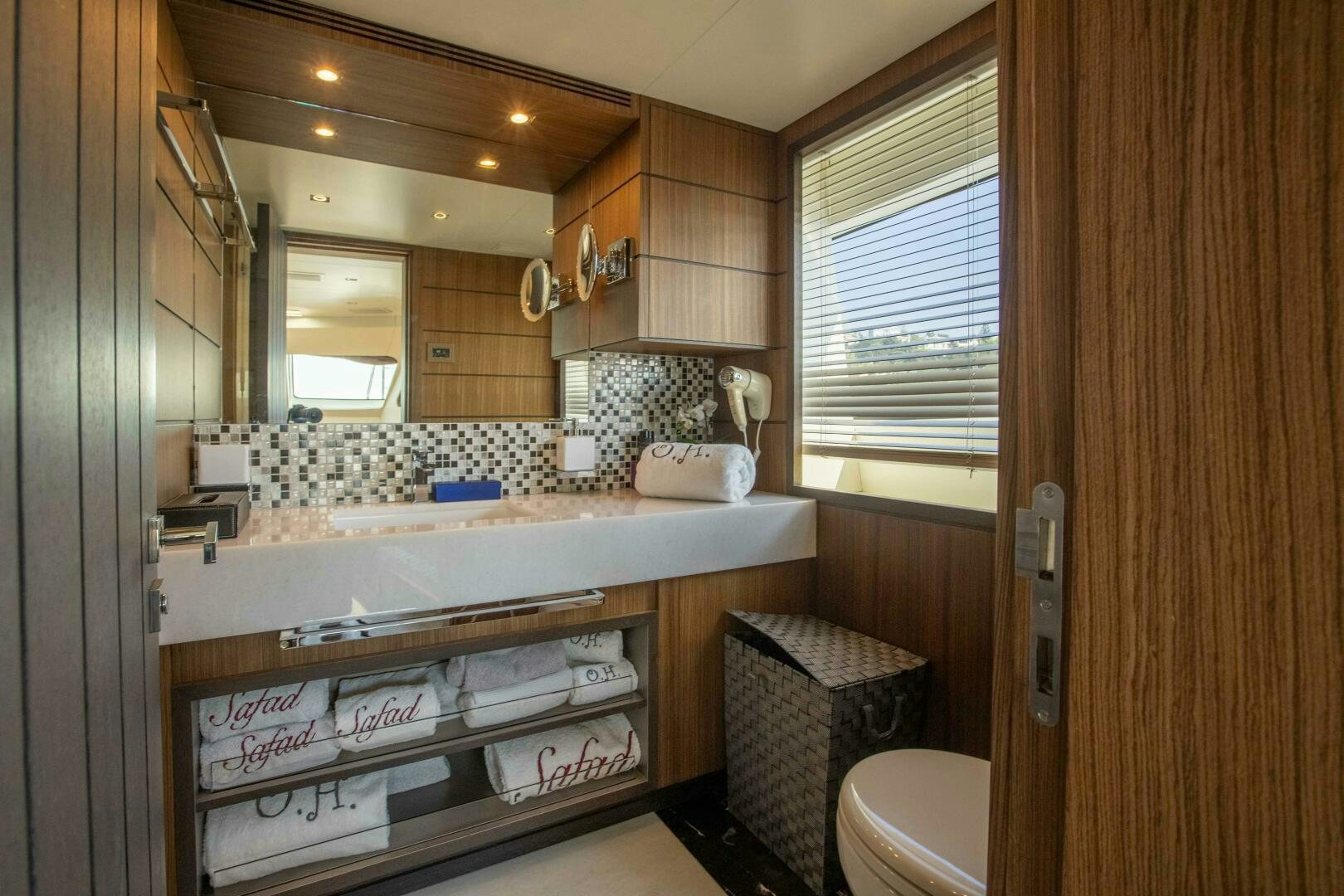 a bathroom with a large mirror aboard SAFAD Yacht for Sale