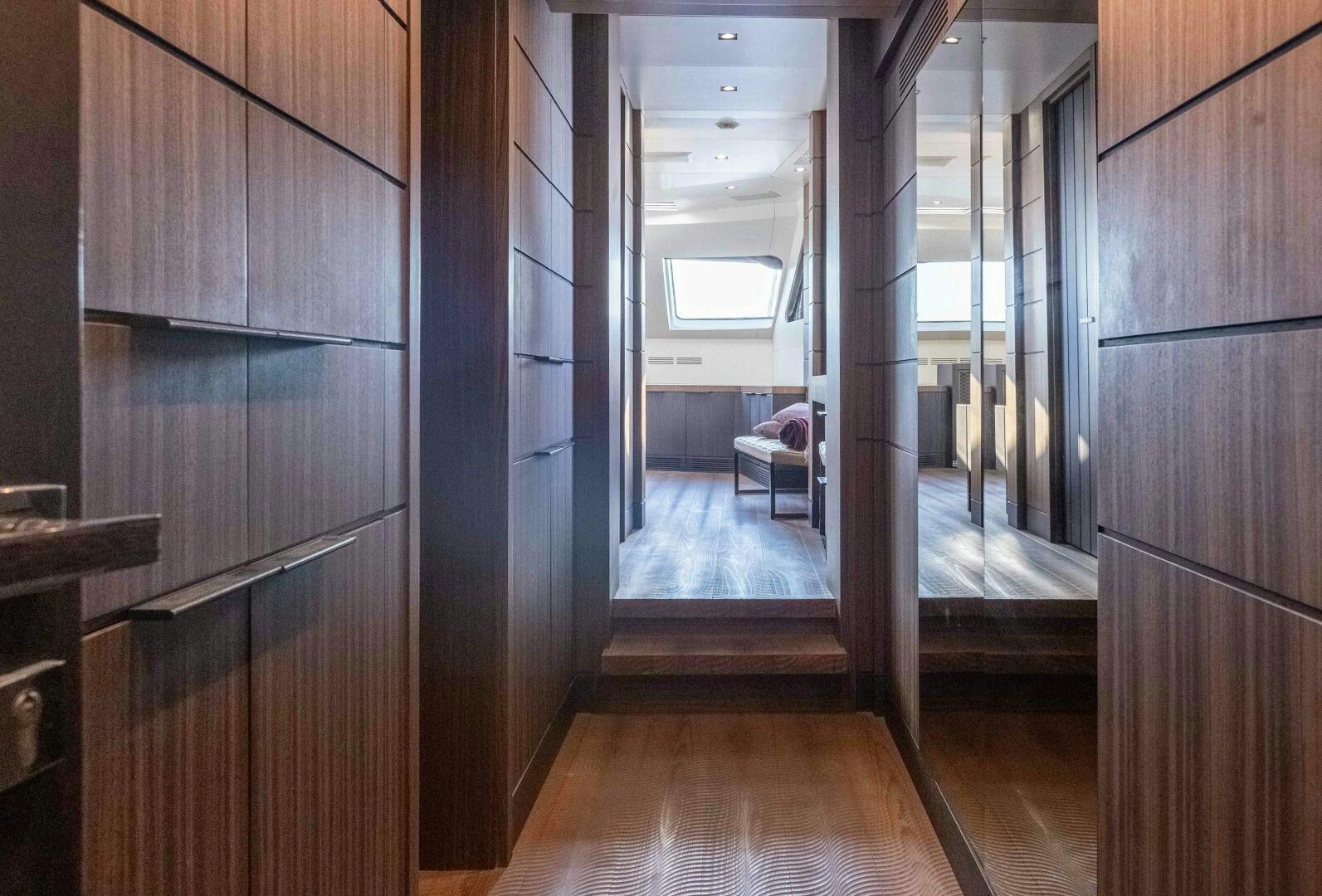 a room with wooden cabinets aboard SAFAD Yacht for Sale