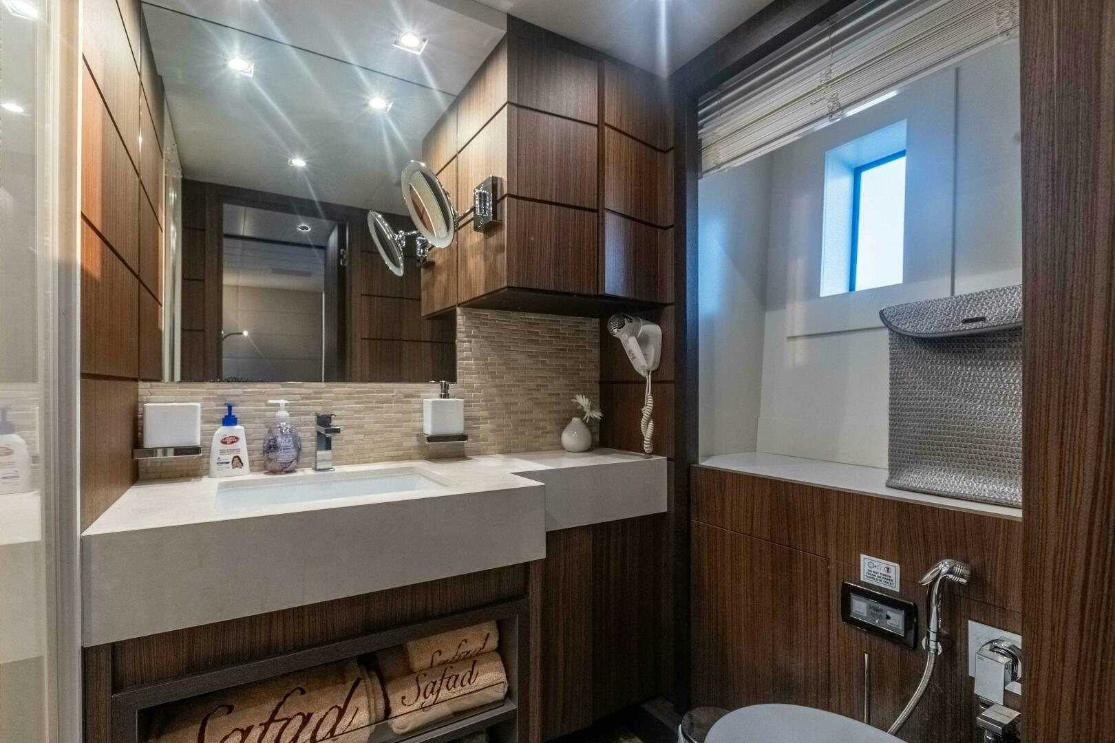 a bathroom with a large mirror aboard SAFAD Yacht for Sale