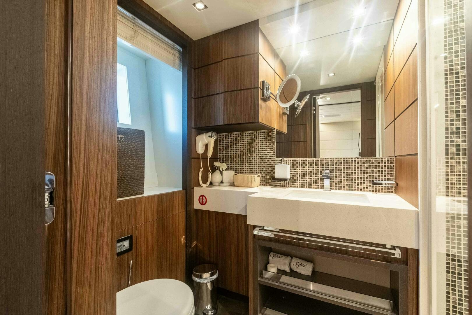 a bathroom with a tub and sink aboard SAFAD Yacht for Sale