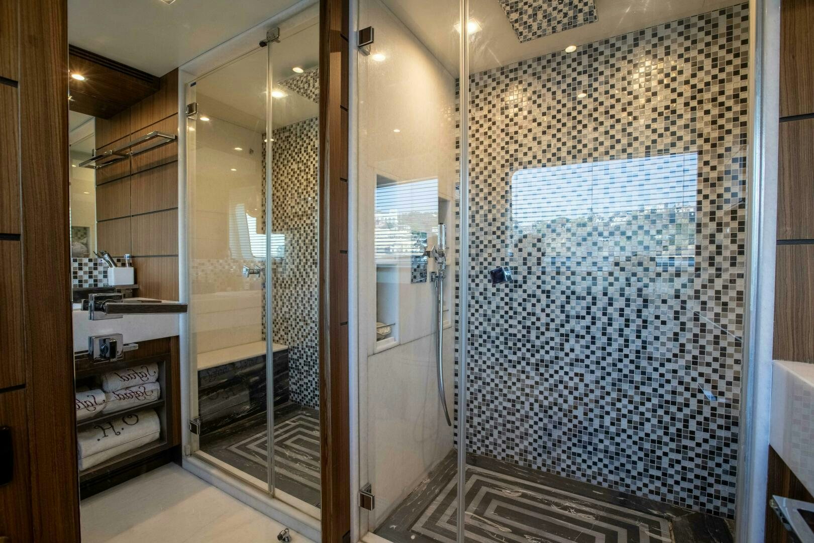 a bathroom with a glass shower aboard SAFAD Yacht for Sale