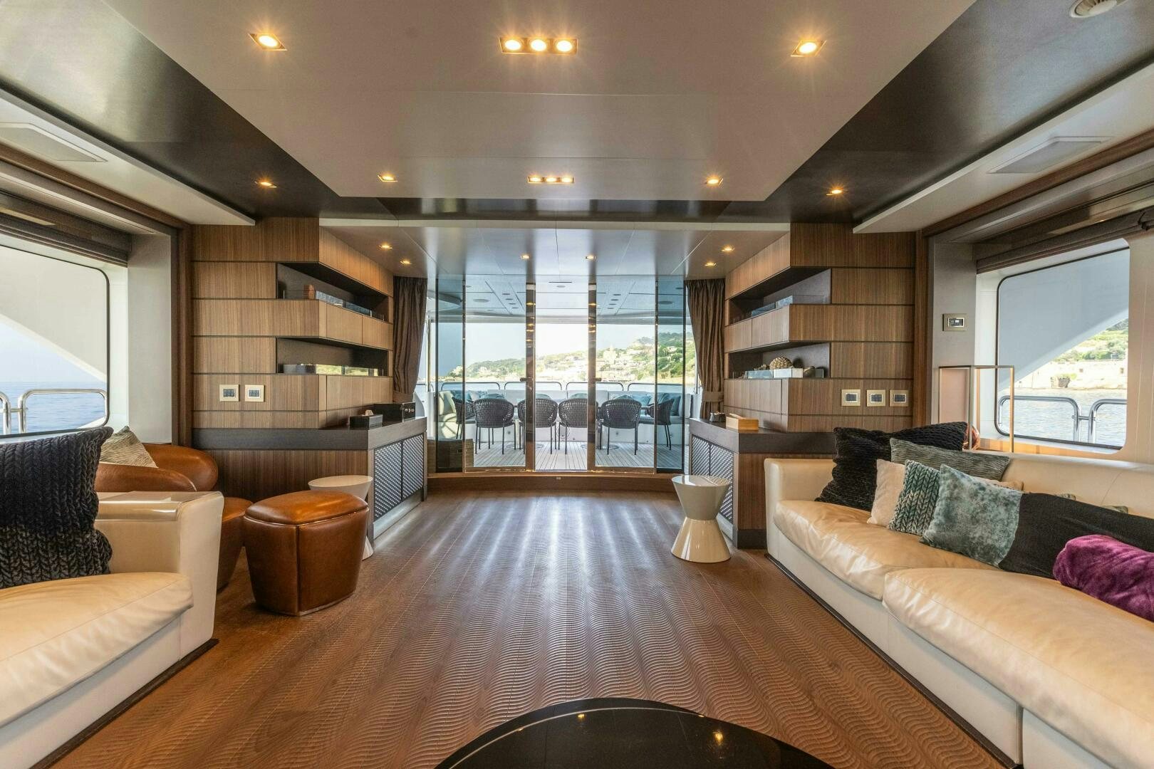 a living room with a wood floor aboard SAFAD Yacht for Sale