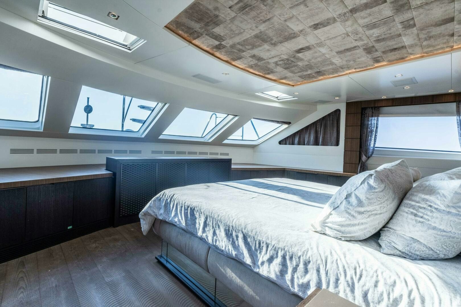 a room with a bed and a window aboard SAFAD Yacht for Sale