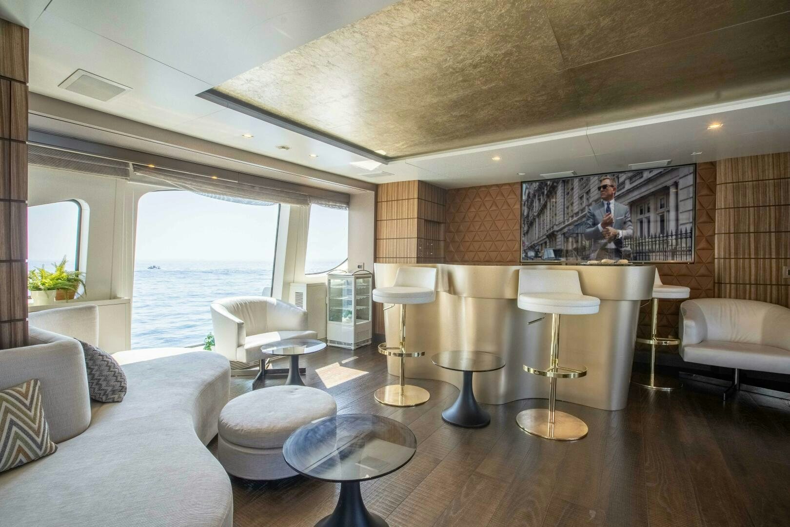 a living room with a large window aboard SAFAD Yacht for Sale