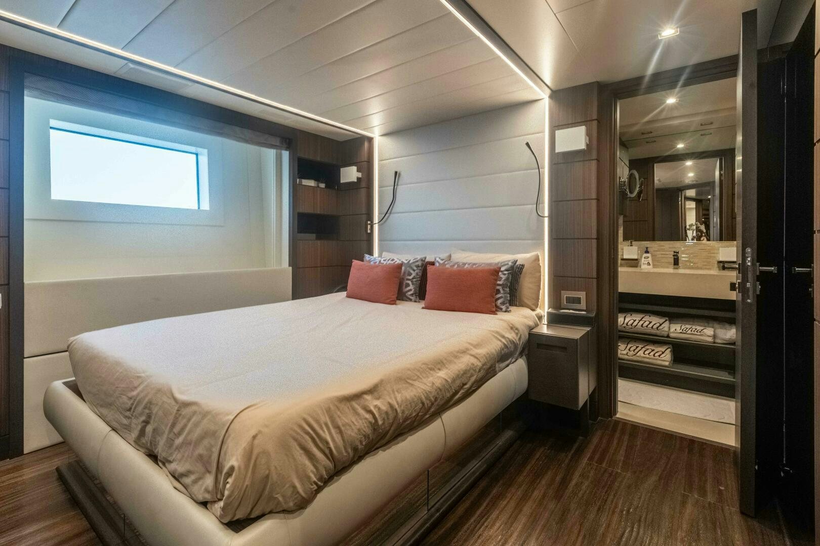 a bedroom with a bed and piano aboard SAFAD Yacht for Sale