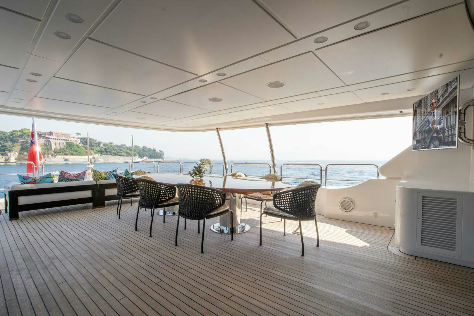 a room with a table chairs and a pool aboard SAFAD Yacht for Sale
