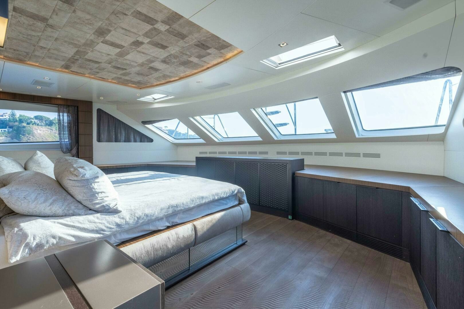 a room with a bed and a window aboard SAFAD Yacht for Sale