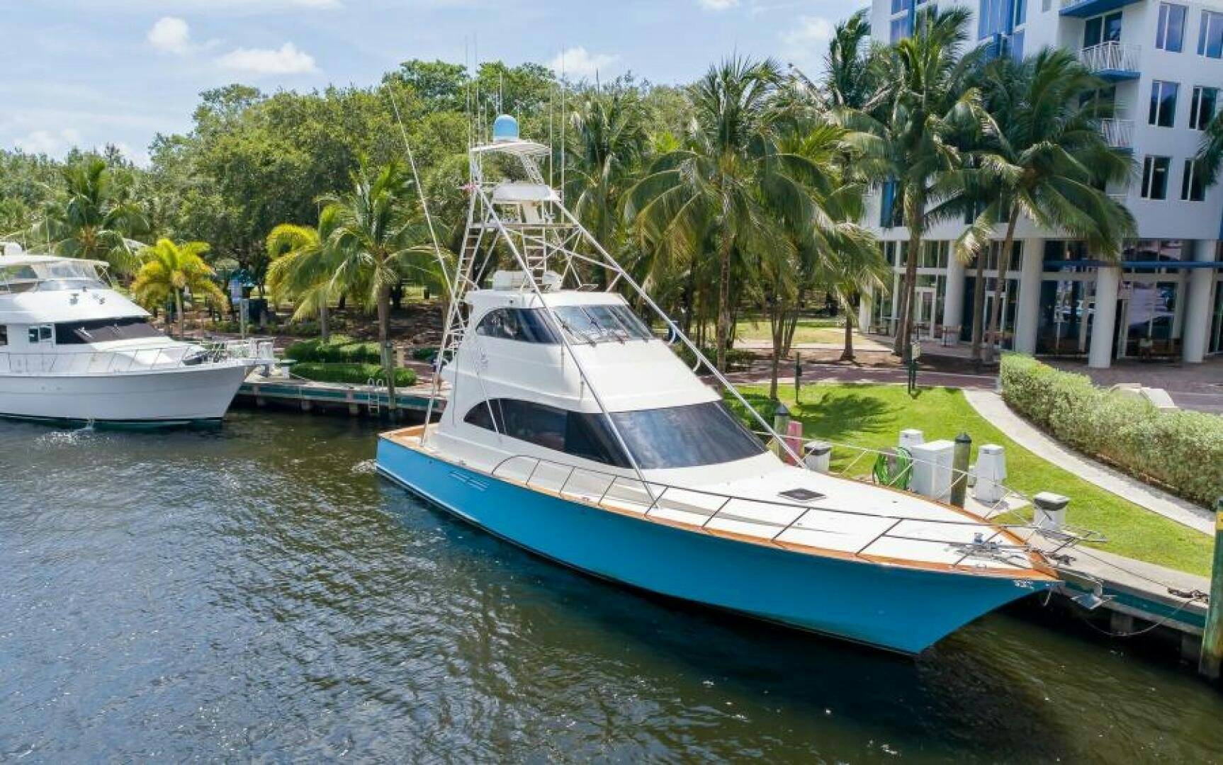 a couple of boats are parked in a harbor aboard BOOMER Yacht for Sale