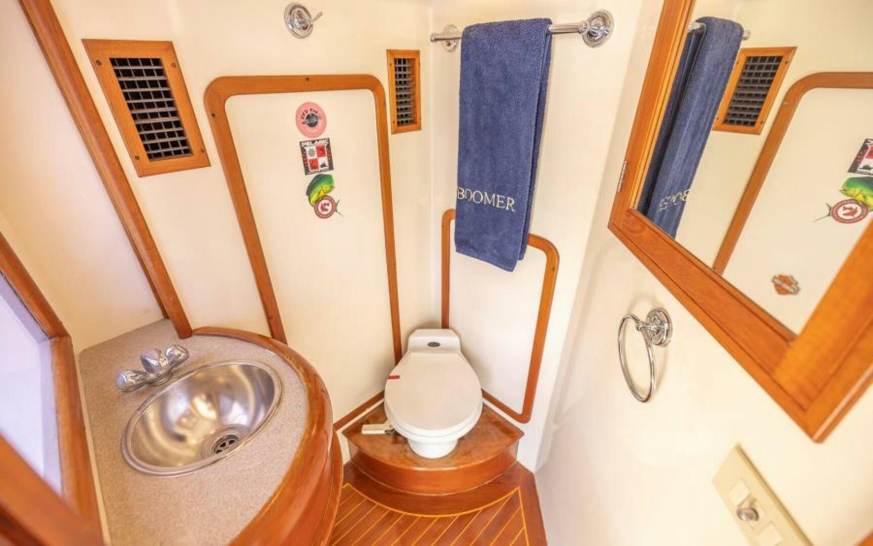 a bathroom with a sink and toilet aboard BOOMER Yacht for Sale