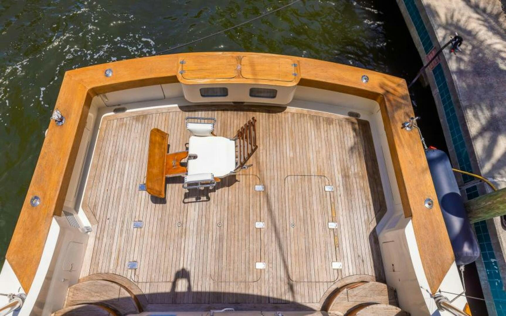 a wooden boat on a trailer aboard BOOMER Yacht for Sale
