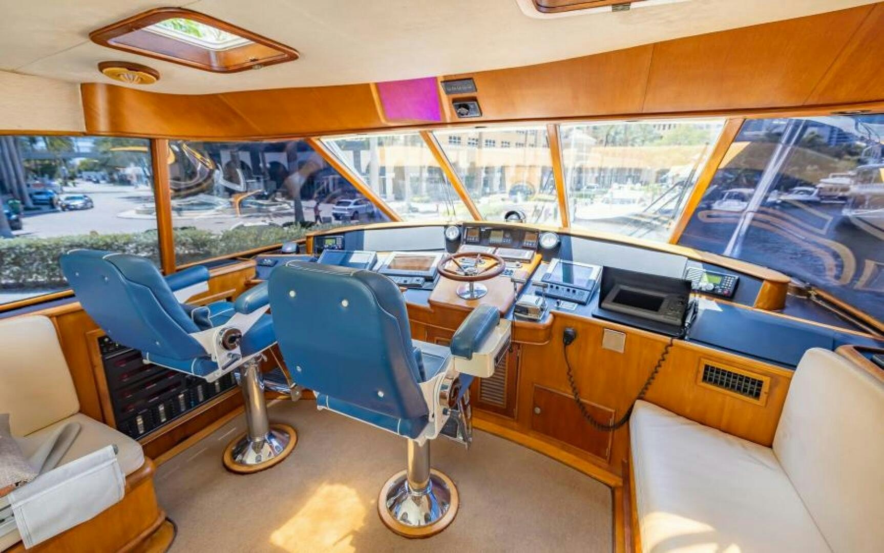 inside of a building with a large window and a view of the city aboard BOOMER Yacht for Sale
