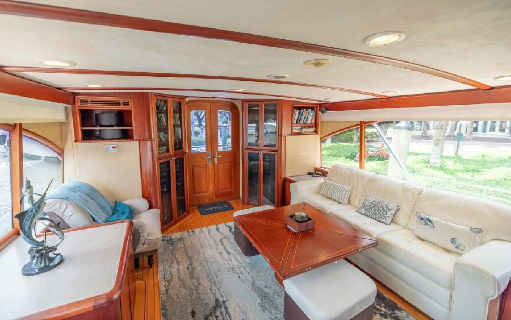 a living room with a couch and a table aboard BOOMER Yacht for Sale