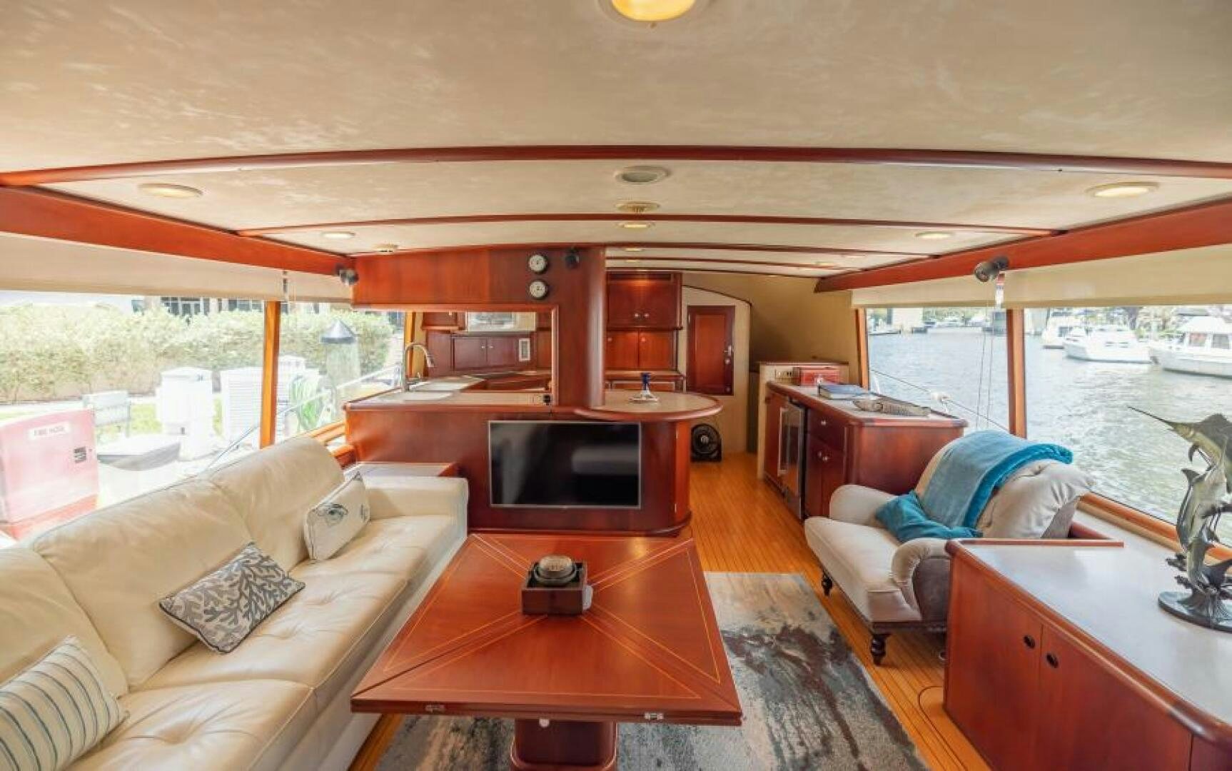 a living room with a couch and a television aboard BOOMER Yacht for Sale