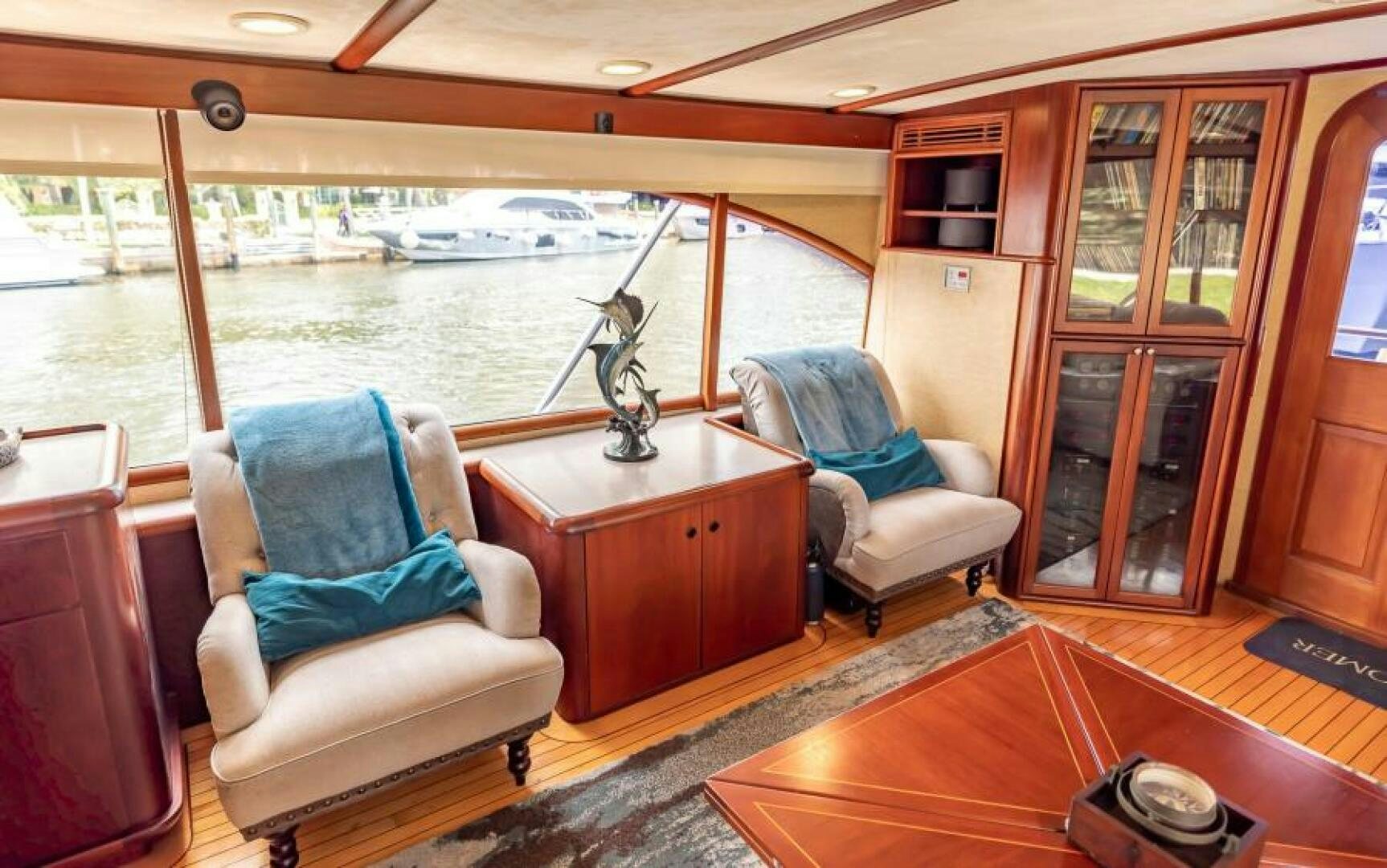 a living room with a view of the water aboard BOOMER Yacht for Sale