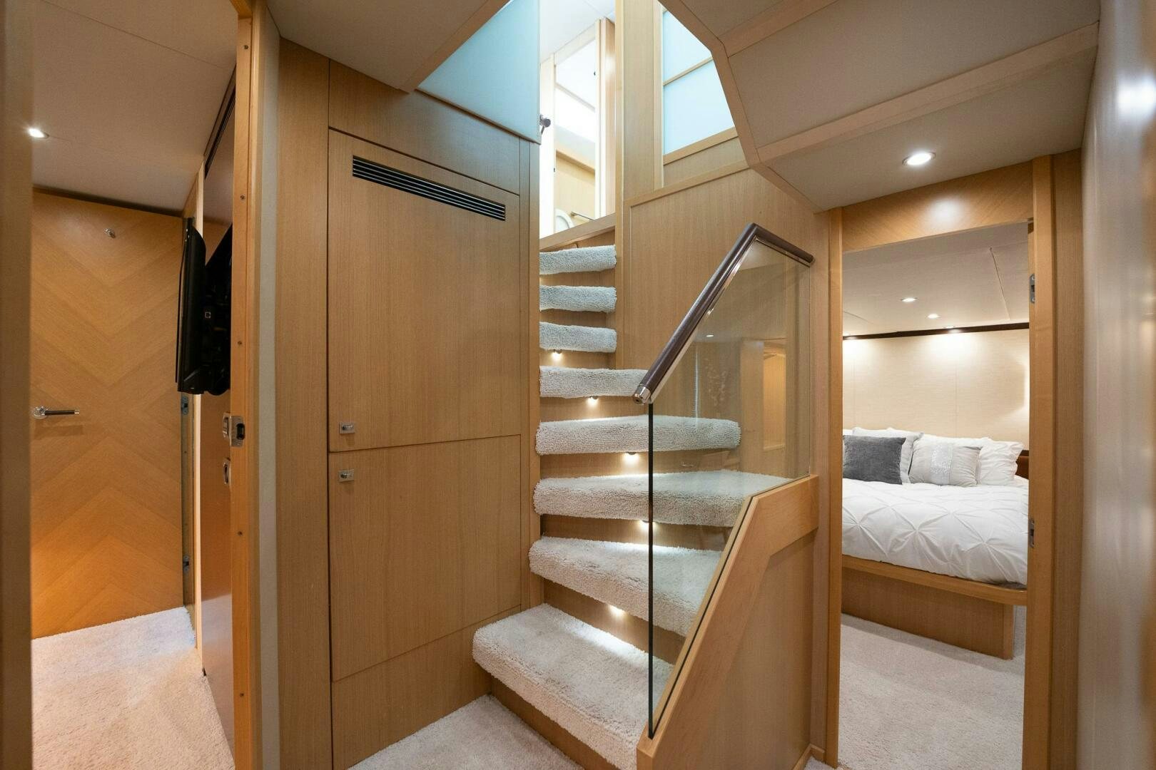 a wooden staircase in a room aboard NO CURFEW Yacht for Sale