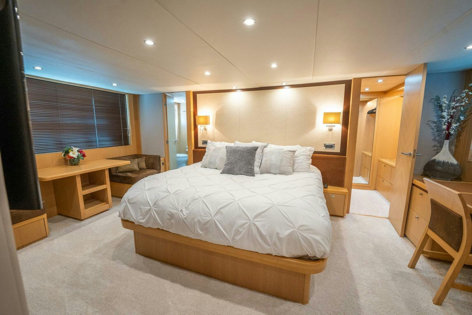a large bedroom with a large bed aboard NO CURFEW Yacht for Sale