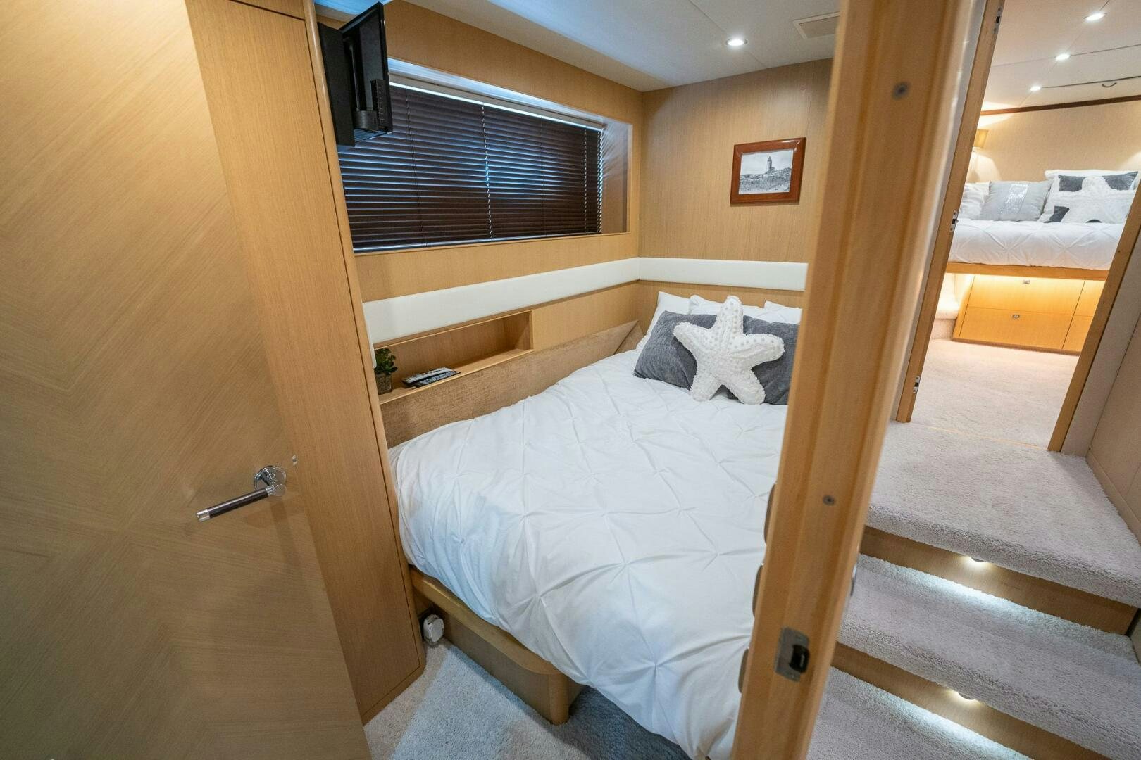 a bed in a room aboard NO CURFEW Yacht for Sale