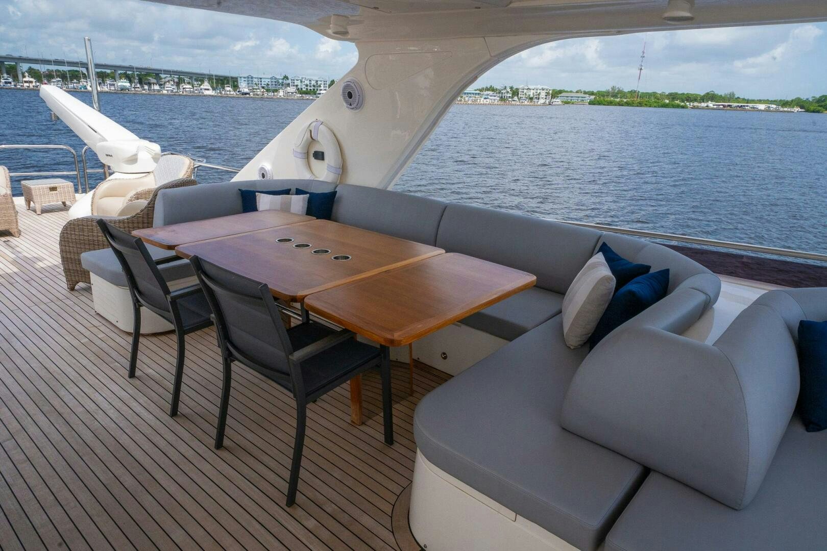 a table and chairs on a boat aboard NO CURFEW Yacht for Sale