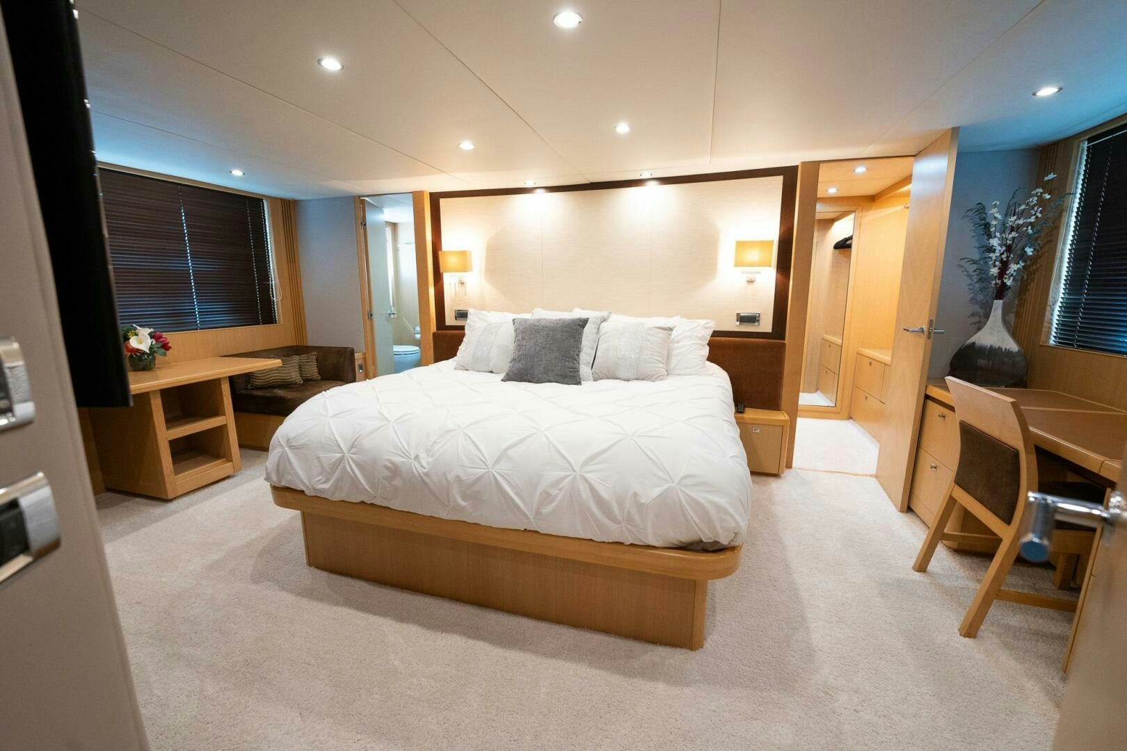 a large bedroom with a large bed aboard NO CURFEW Yacht for Sale
