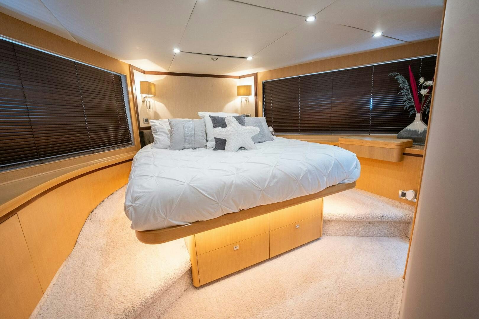 a room with a bed and a window aboard NO CURFEW Yacht for Sale