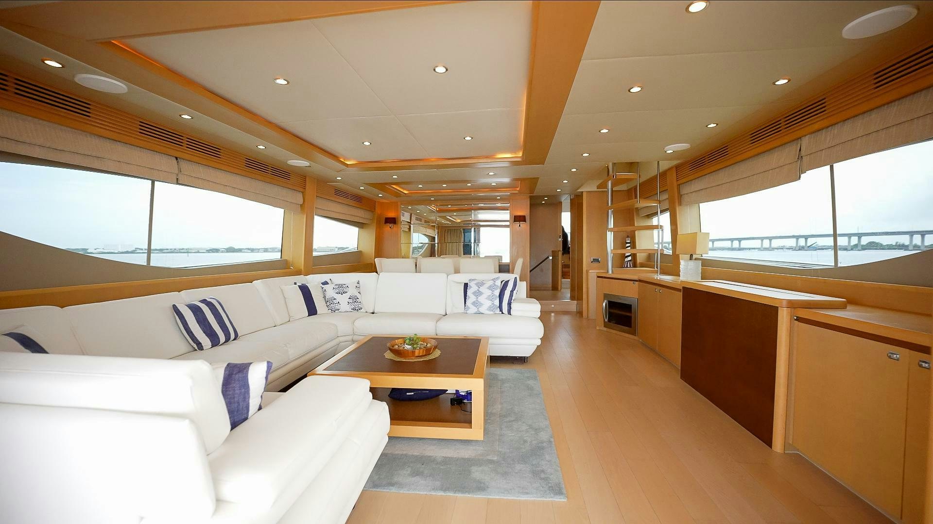 a living room with a couch and a table aboard NO CURFEW Yacht for Sale