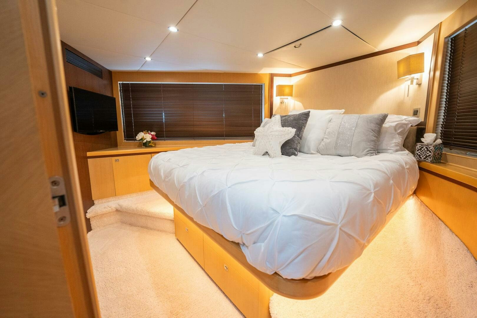 a bed in a room aboard NO CURFEW Yacht for Sale