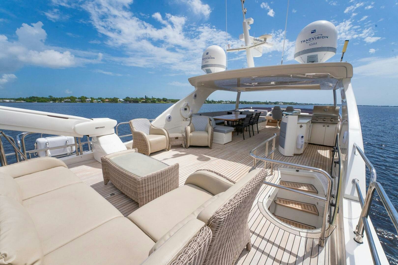 a deck with a boat and a satellite dish on it aboard NO CURFEW Yacht for Sale