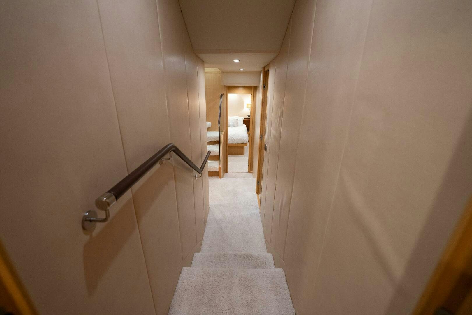 a hallway with a white wall aboard NO CURFEW Yacht for Sale