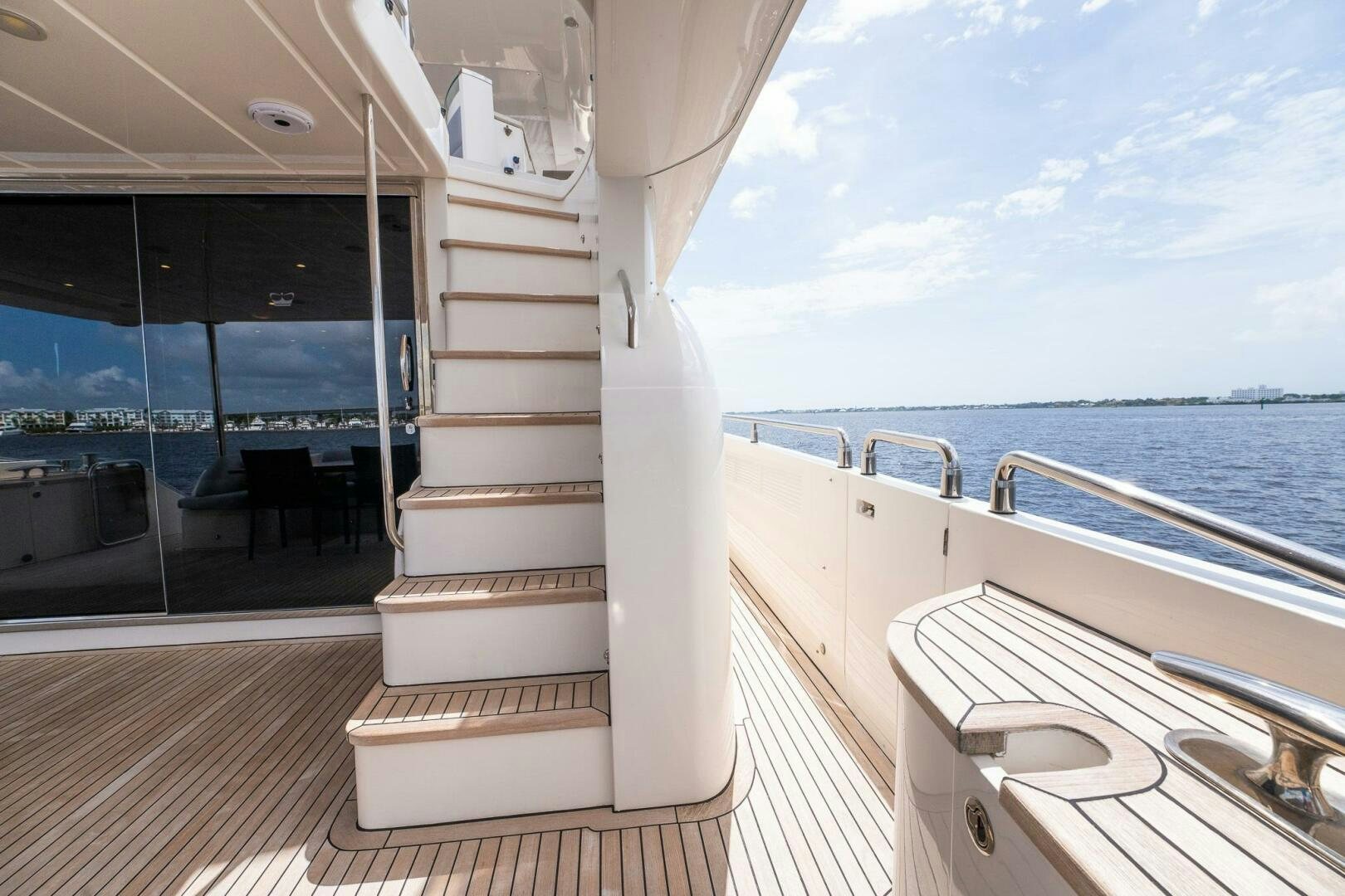 a white staircase on a boat aboard NO CURFEW Yacht for Sale