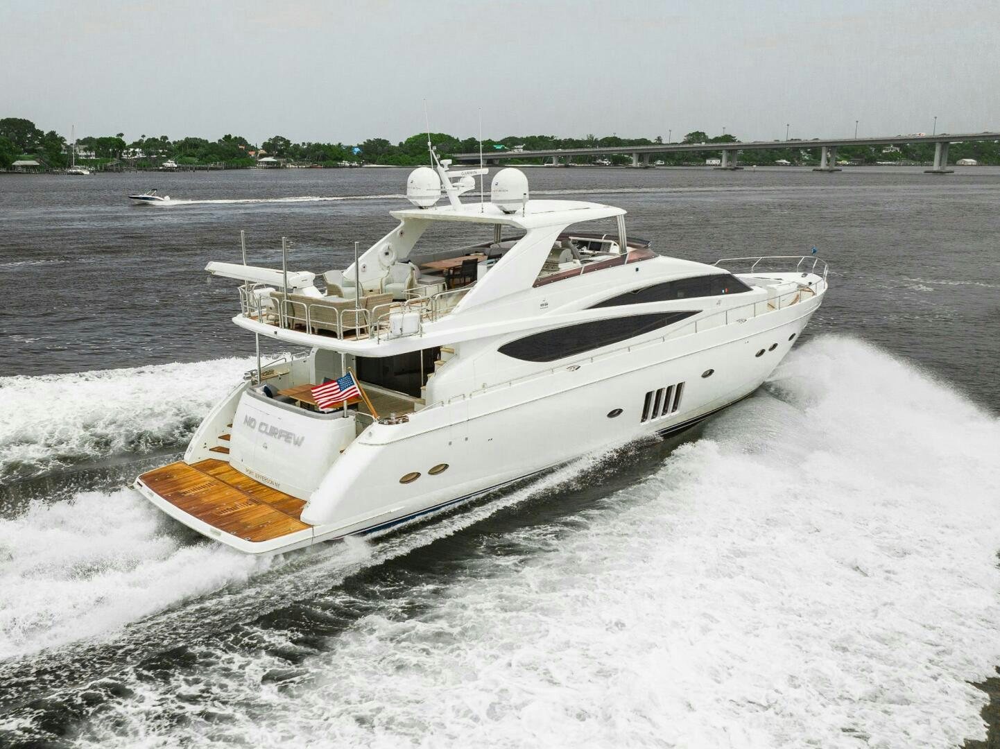 a boat on the water aboard NO CURFEW Yacht for Sale