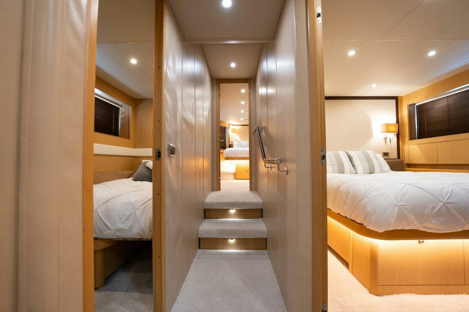 a room with a bed and a mirror aboard NO CURFEW Yacht for Sale