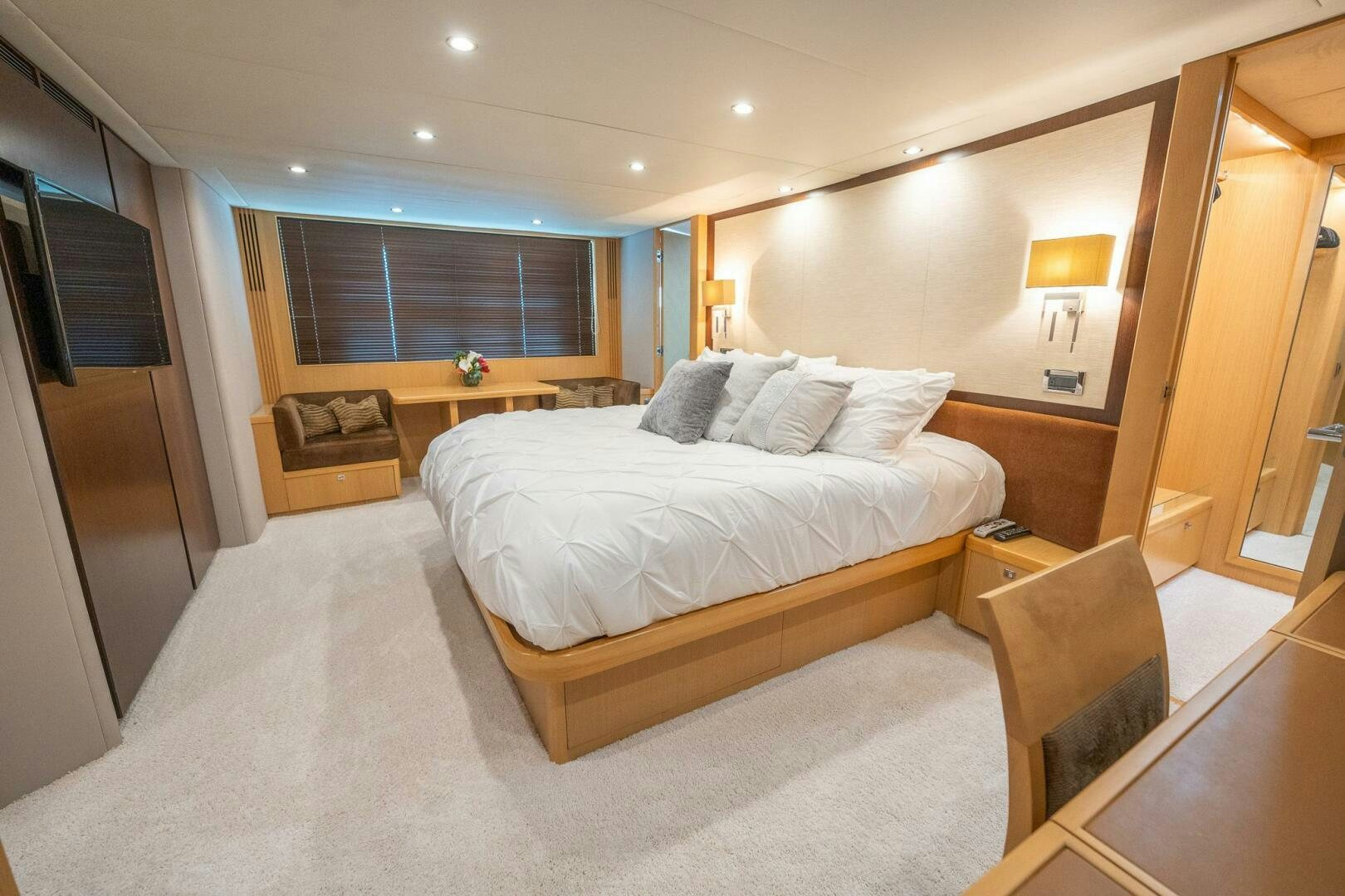 a large bedroom with a large bed aboard NO CURFEW Yacht for Sale