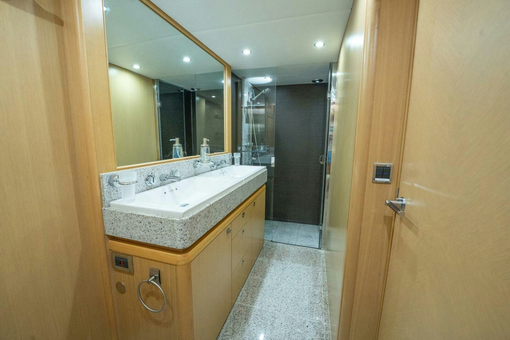 a bathroom with a large mirror aboard NO CURFEW Yacht for Sale