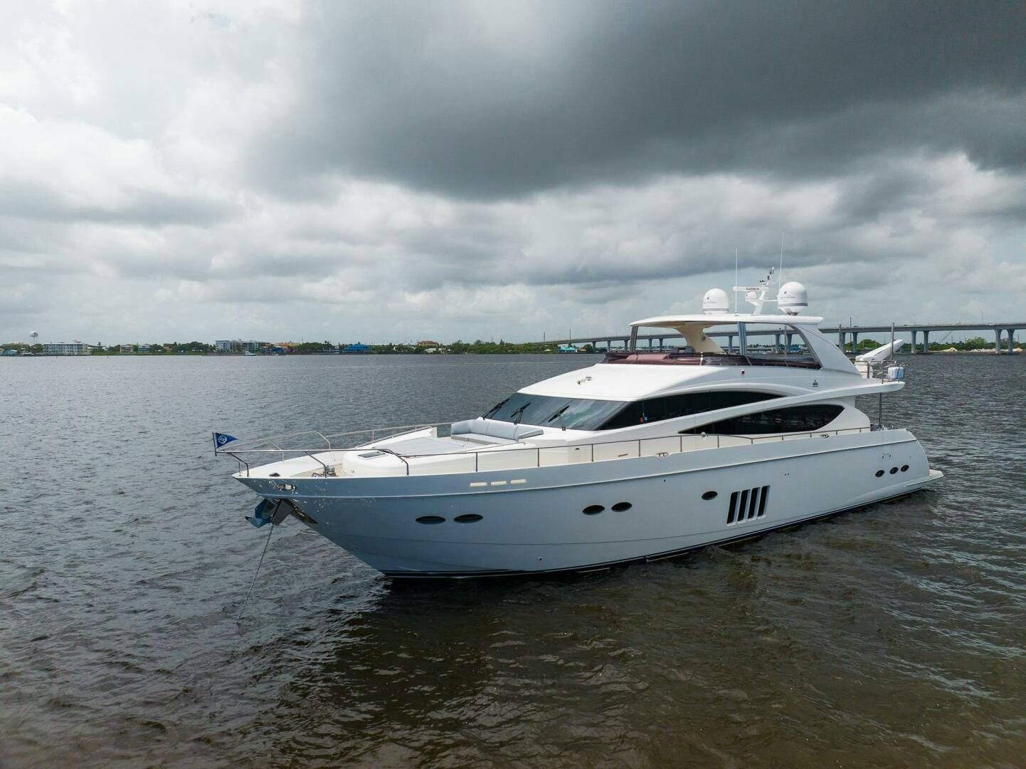a white boat in a body of water aboard NO CURFEW Yacht for Sale