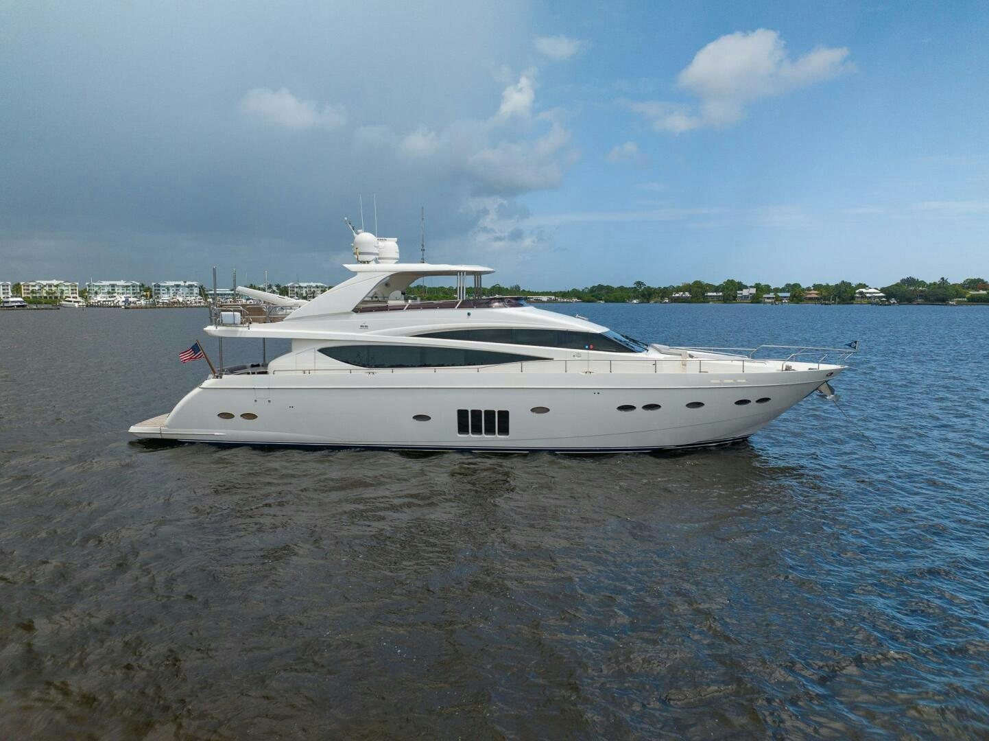a white boat in the water aboard NO CURFEW Yacht for Sale