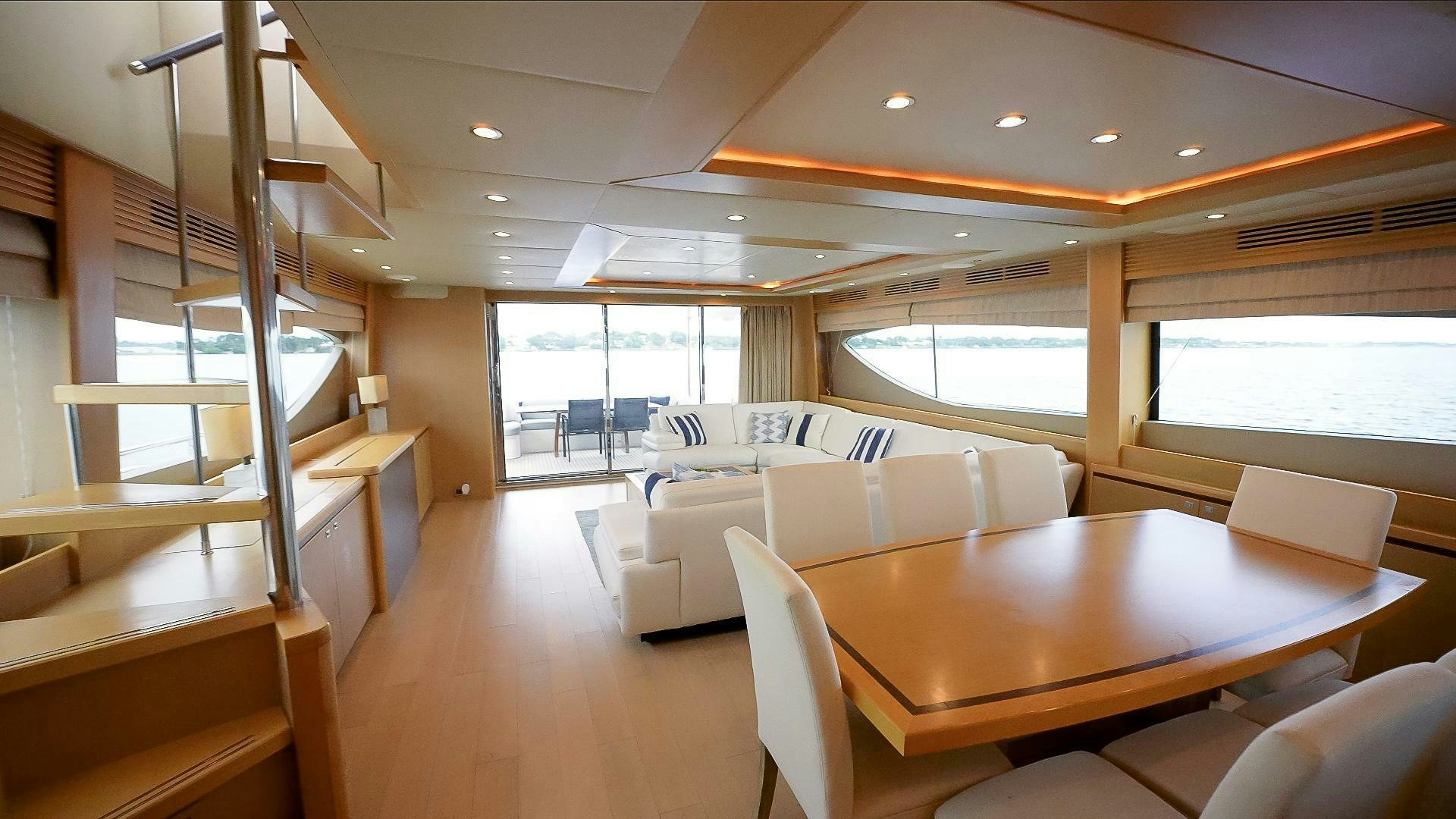 a room with a table and chairs aboard NO CURFEW Yacht for Sale