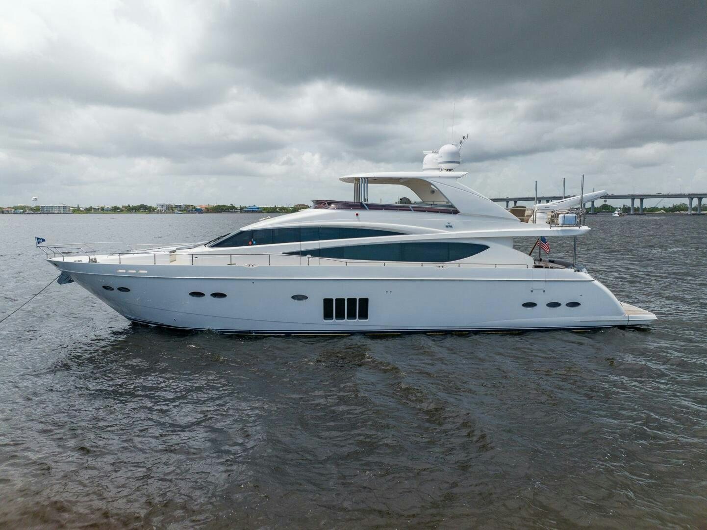 a white boat on the water aboard NO CURFEW Yacht for Sale
