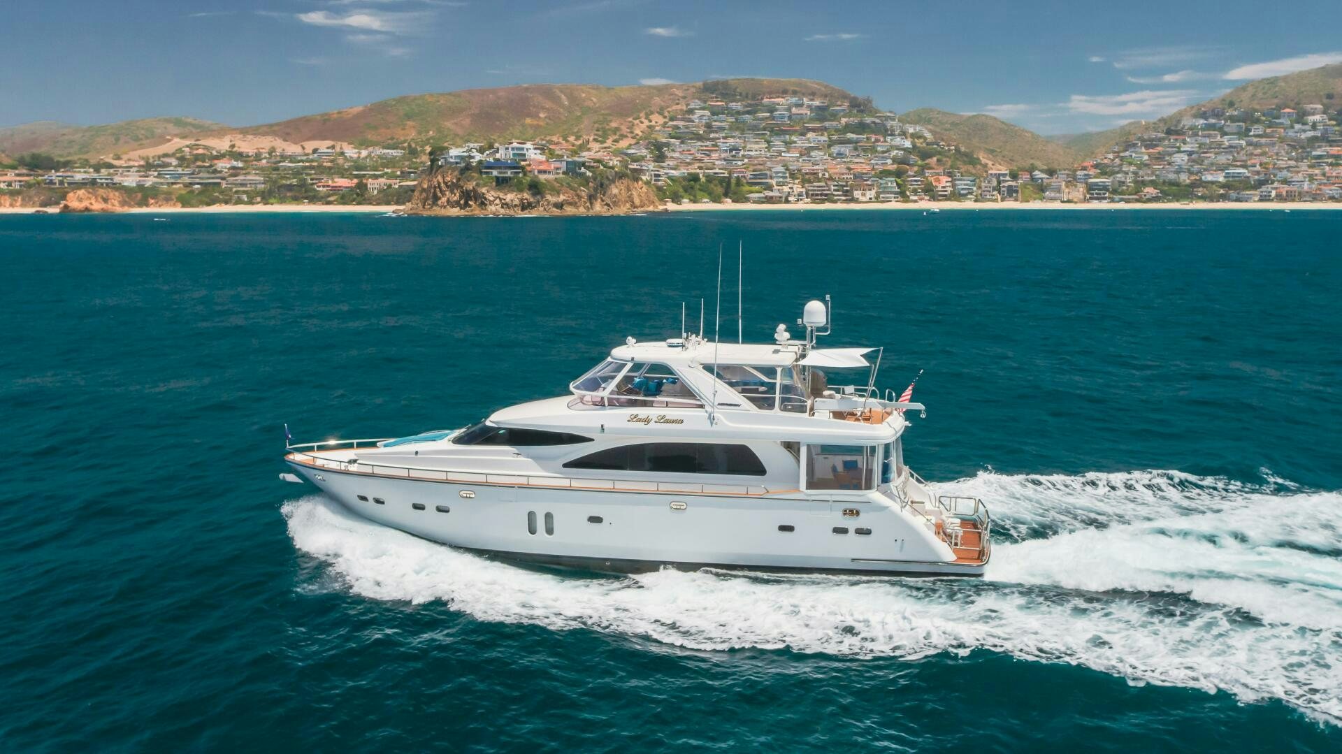 a white yacht on the water aboard LADY LAURA Yacht for Sale