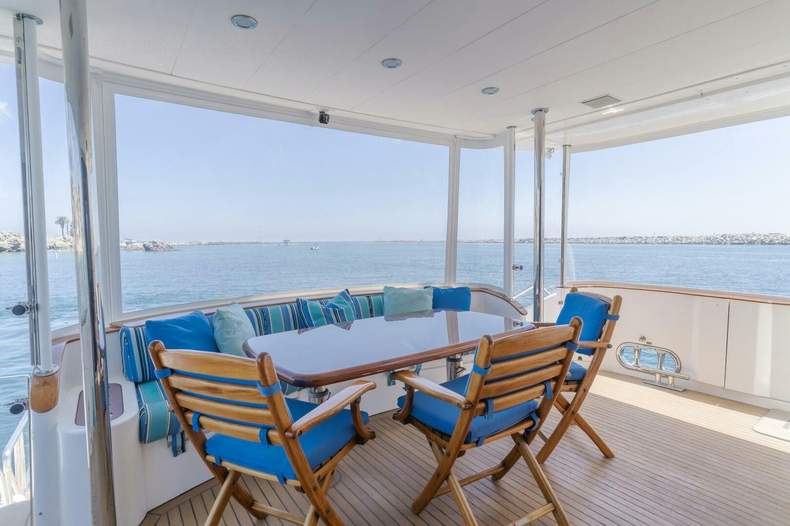a deck with chairs on it aboard LADY LAURA Yacht for Sale