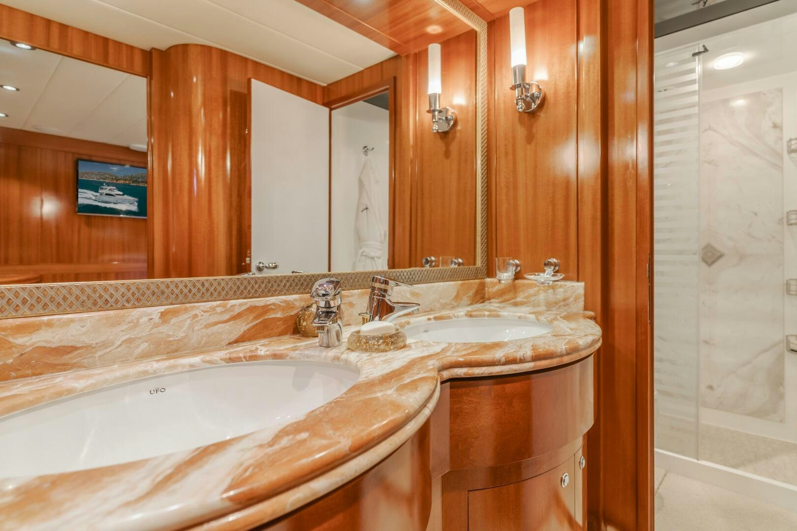 a bathroom with a large mirror aboard LADY LAURA Yacht for Sale