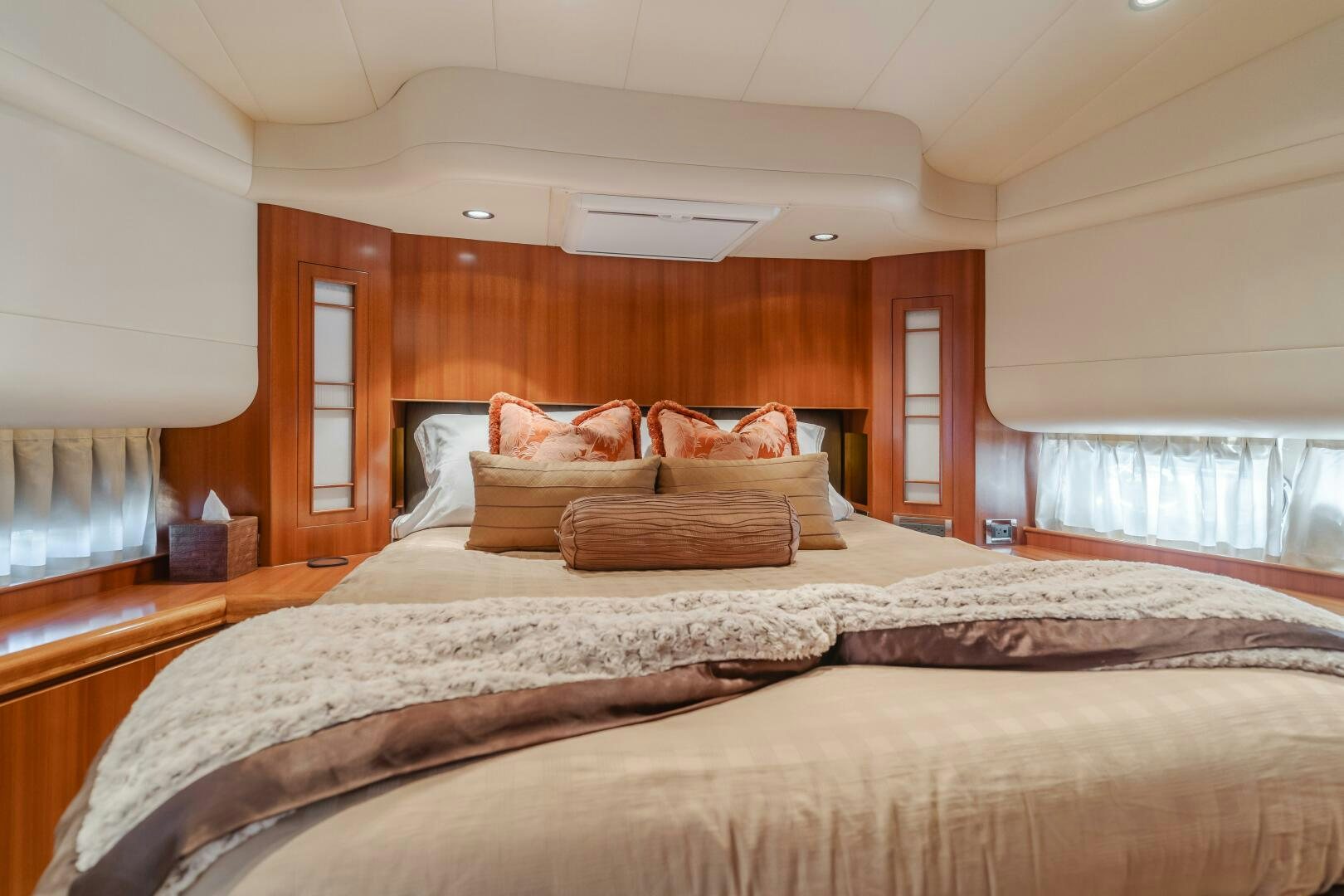 a bedroom with a bed and a window aboard LADY LAURA Yacht for Sale