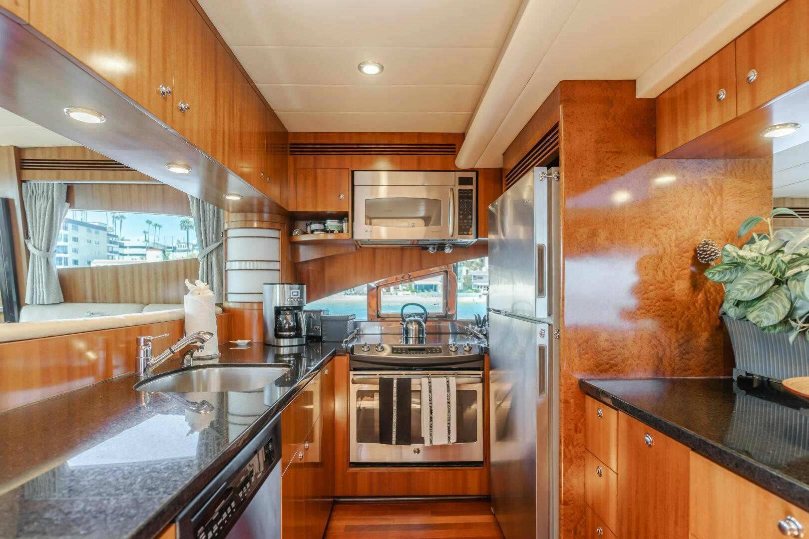 a kitchen with wooden cabinets aboard LADY LAURA Yacht for Sale