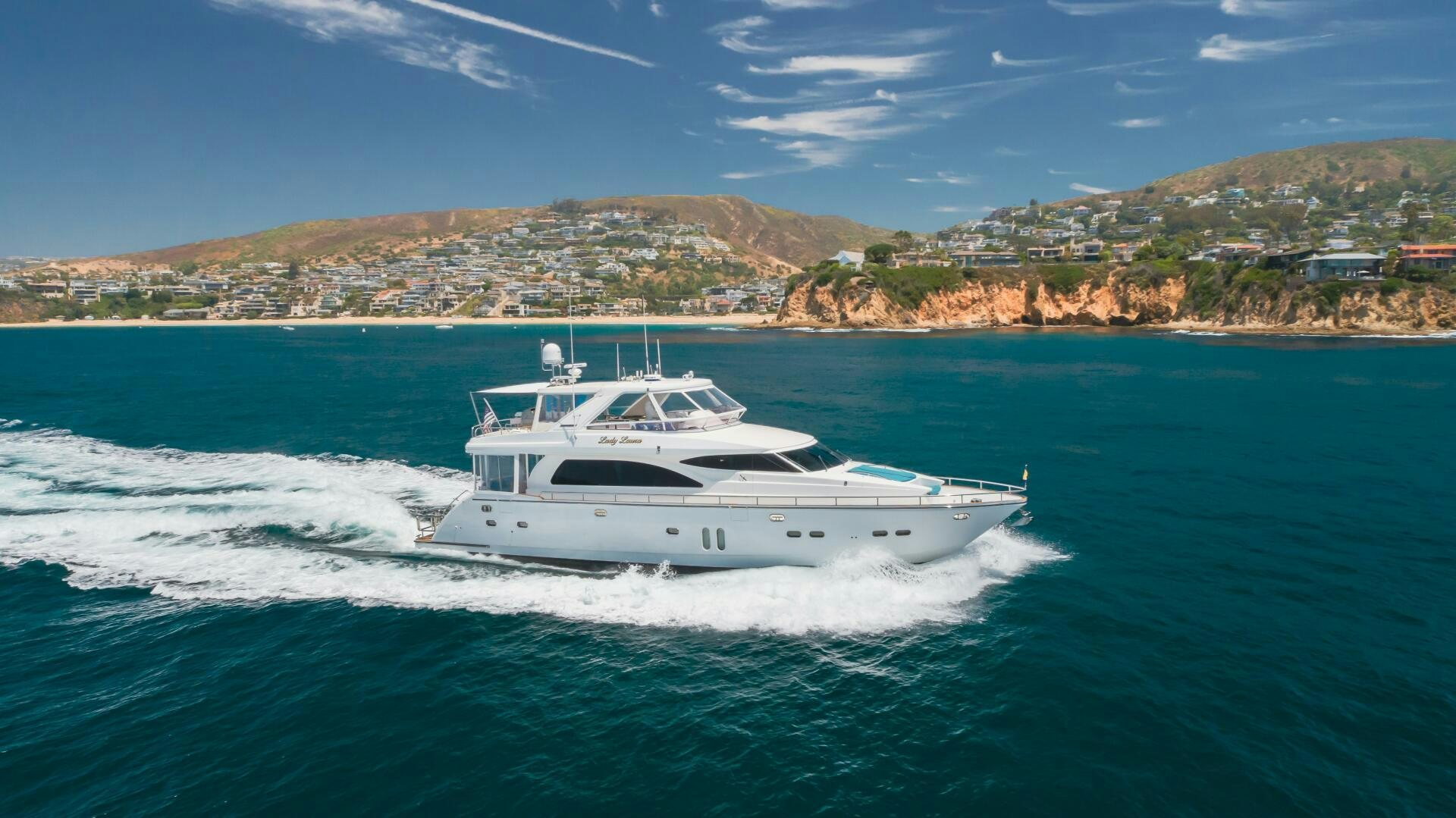a white boat on the water aboard LADY LAURA Yacht for Sale