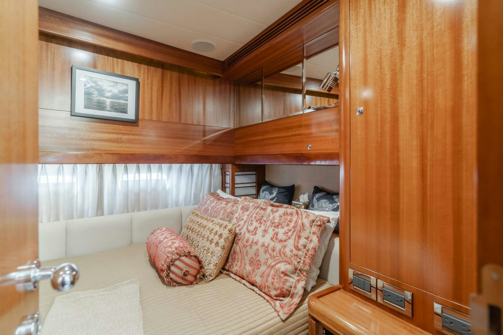 a room with a bed and a wood cabinet aboard LADY LAURA Yacht for Sale