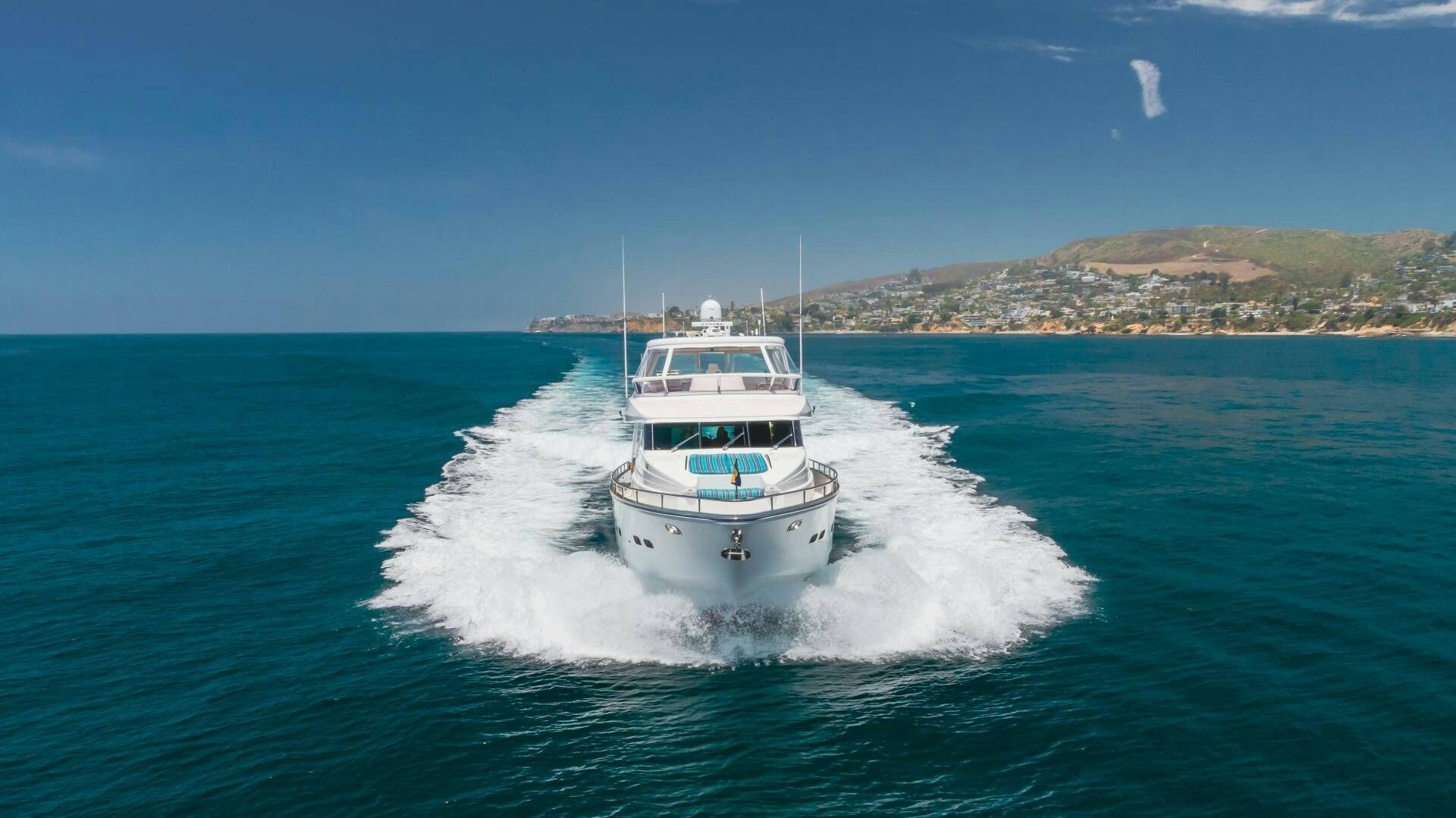 a white boat on the water aboard LADY LAURA Yacht for Sale