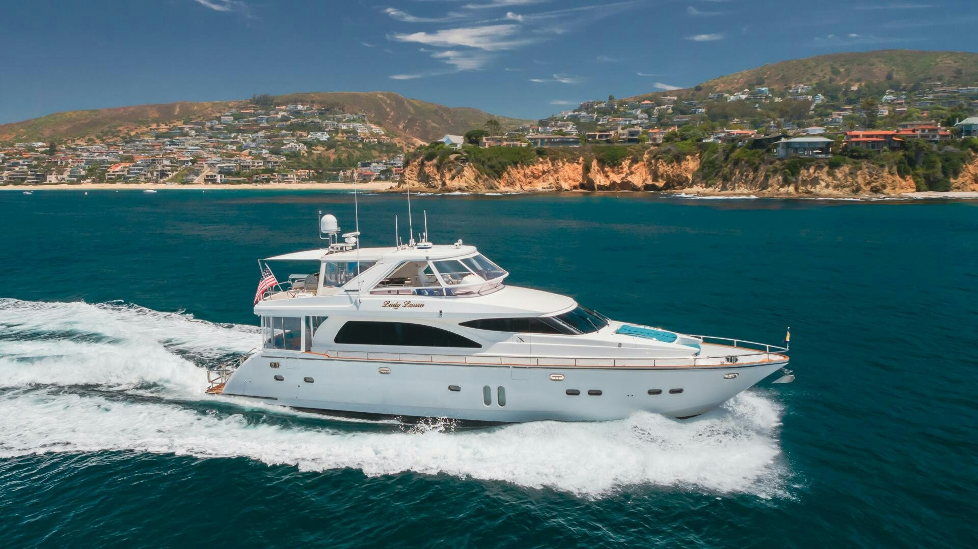 a white boat on water aboard LADY LAURA Yacht for Sale