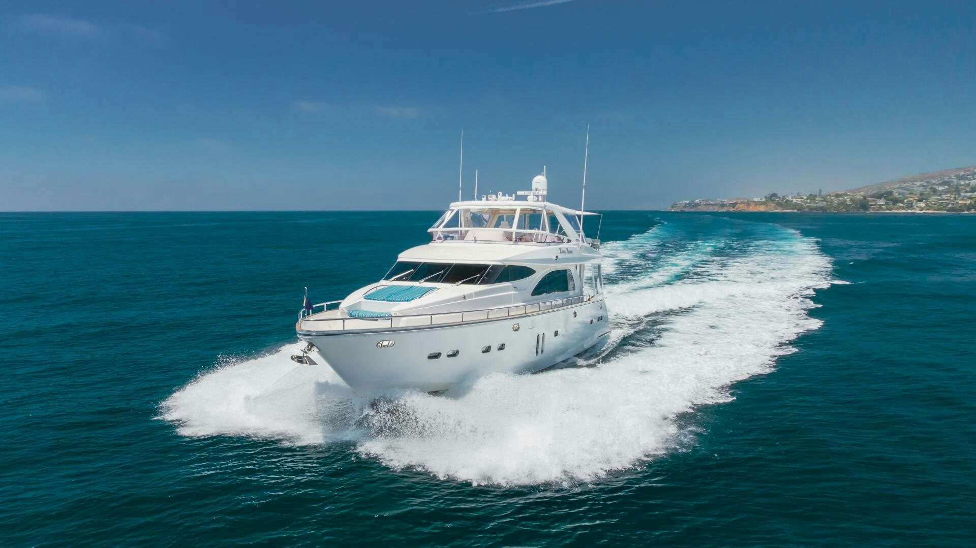a white yacht on the water aboard LADY LAURA Yacht for Sale