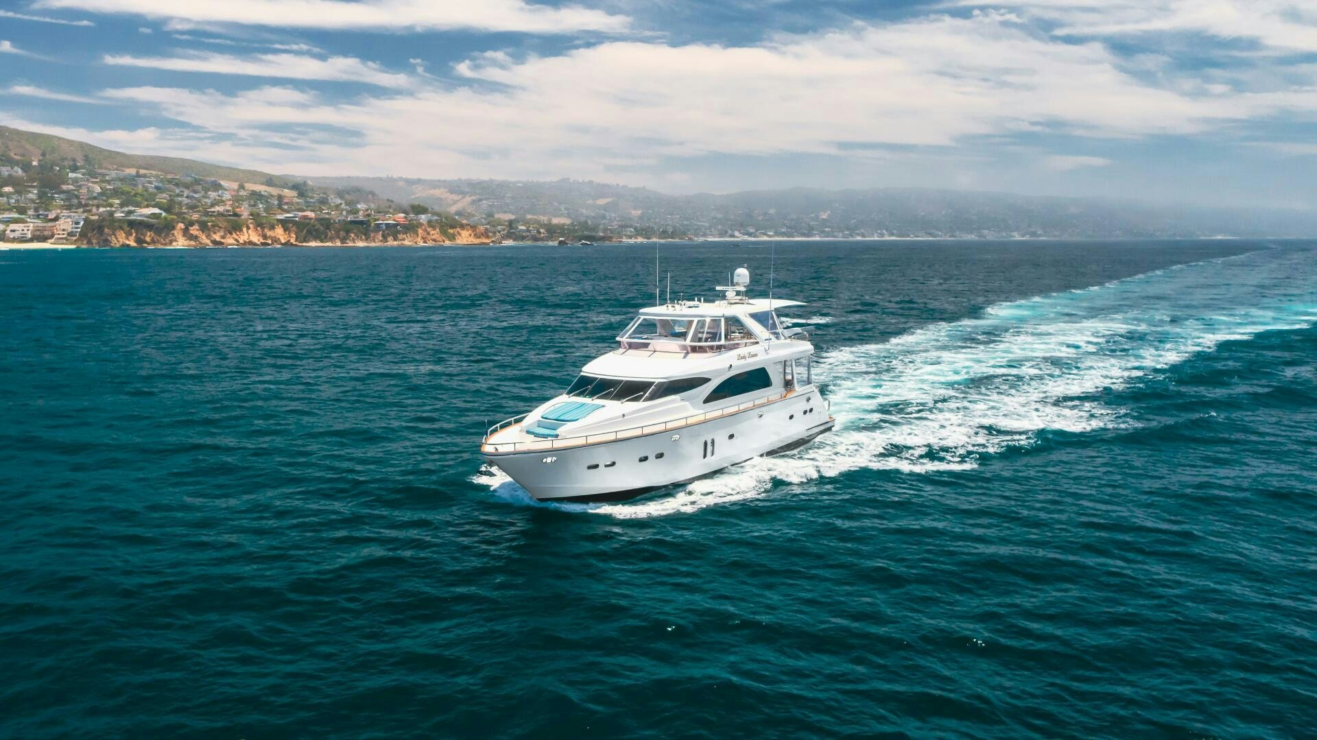 a white boat in the water aboard LADY LAURA Yacht for Sale