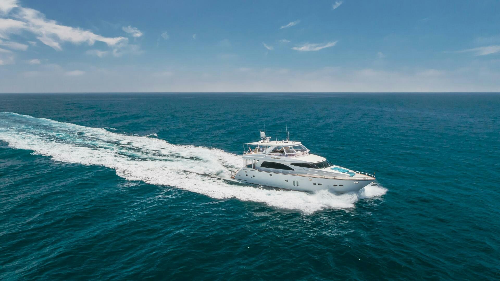 a white boat on the water aboard LADY LAURA Yacht for Sale